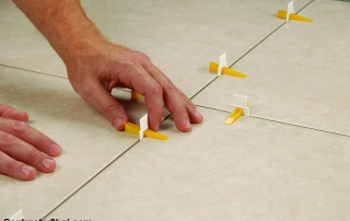 Tiles edge levelling system